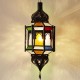 Lampada ottagonale andaluso con barre e cupole in ferro traforato e vetro colorato