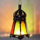 Lanterne à bougie en verre et fer ajouré