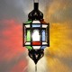 Lampada ottagonale andaluso con barre e cupole in ferro traforato e vetro colorato